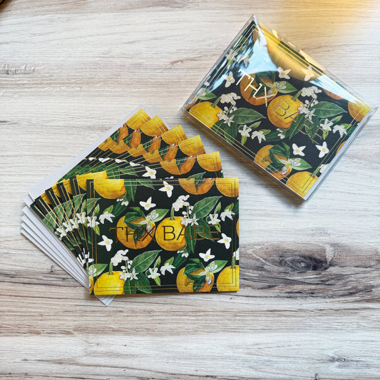 Set of 6 folded full color gold foil stamped cards with dark green background and watercolor painted orange blossom flowers and oranges in foreground, blank inside. 6 luxe gray envelopes.