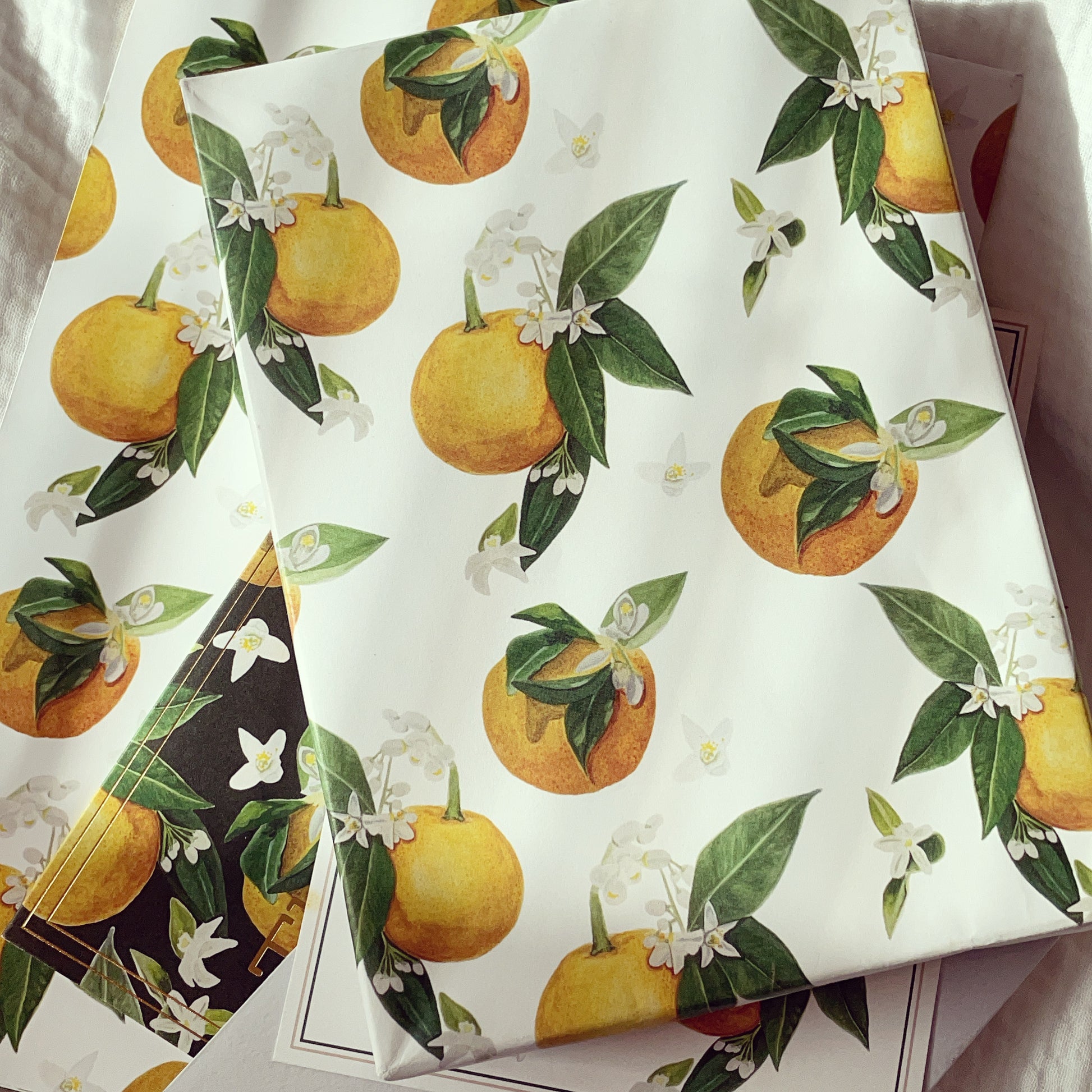 Orange Blossom Wrapping Paper lays on top of some other Orange Blossom Collection products, like our THX BABE fold over card and Personal Stationery Set.